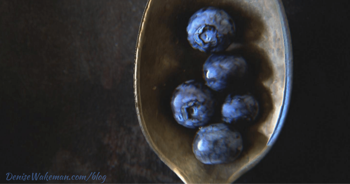 5 blueberries in a spoon